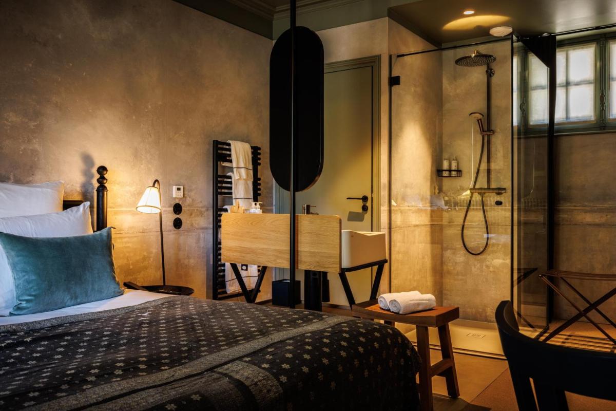 Un ou plusieurs lits dans un hébergement de l'établissement Domaine de Locguénolé & Spa - Relais & Chateaux