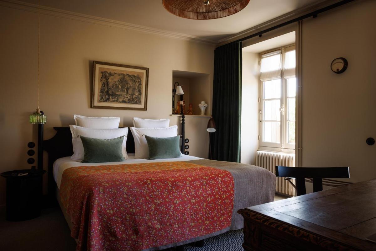 Un ou plusieurs lits dans un hébergement de l'établissement Domaine de Locguénolé & Spa - Relais & Chateaux