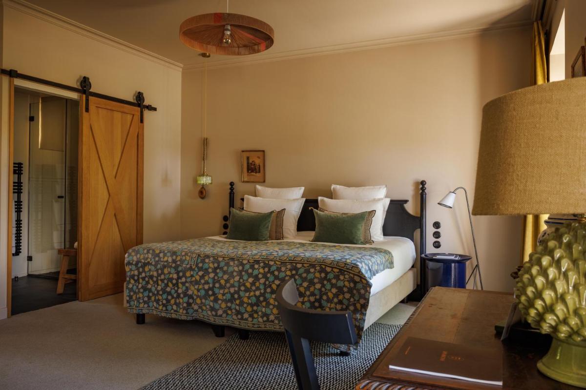 Un ou plusieurs lits dans un hébergement de l'établissement Domaine de Locguénolé & Spa - Relais & Chateaux