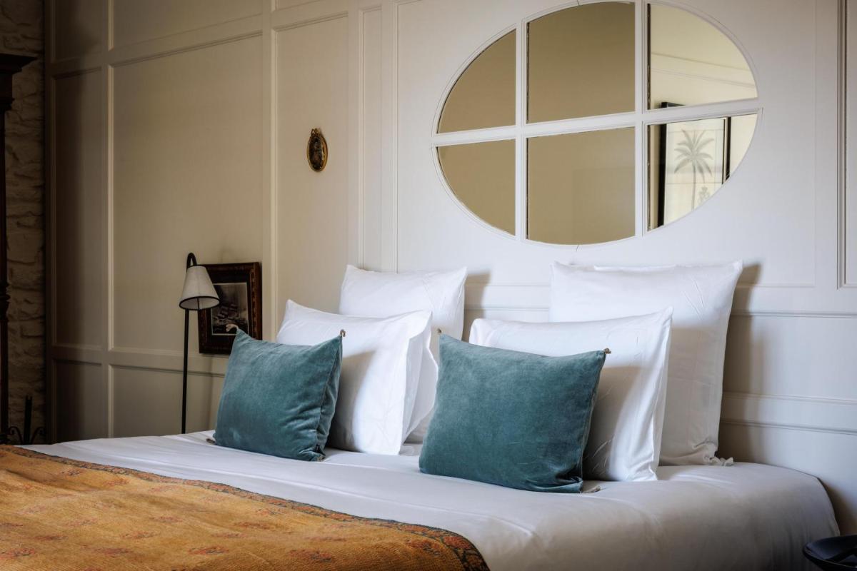 Un ou plusieurs lits dans un hébergement de l'établissement Domaine de Locguénolé & Spa - Relais & Chateaux