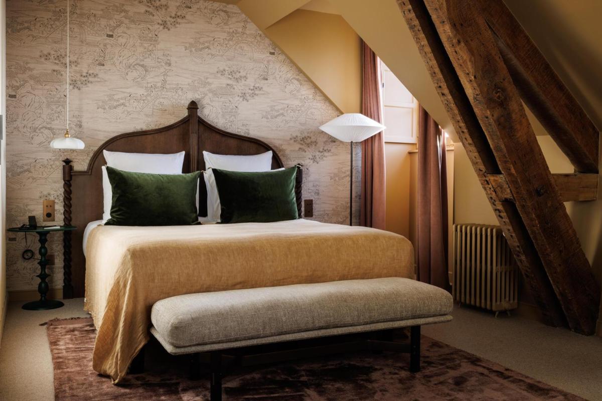 Un ou plusieurs lits dans un hébergement de l'établissement Domaine de Locguénolé & Spa - Relais & Chateaux