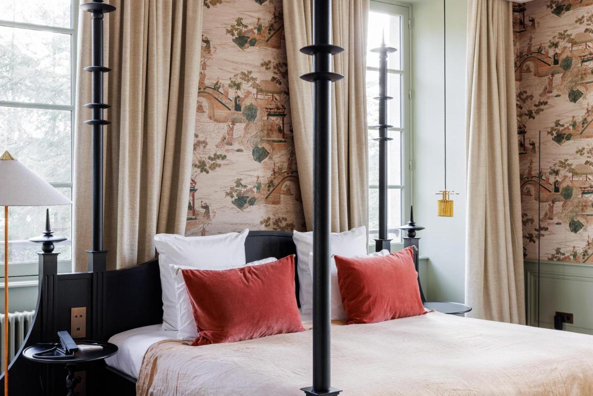 Un ou plusieurs lits dans un hébergement de l'établissement Domaine de Locguénolé & Spa - Relais & Chateaux