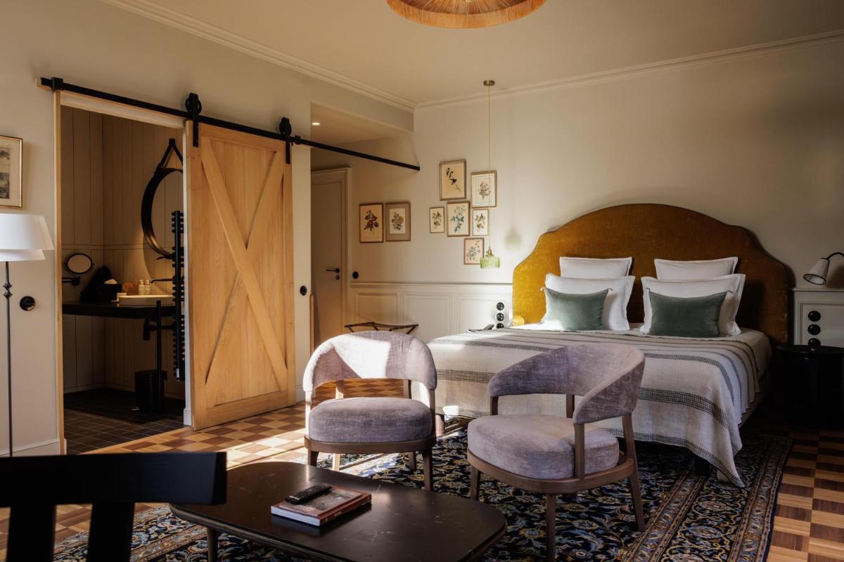 Un ou plusieurs lits dans un hébergement de l'établissement Domaine de Locguénolé & Spa - Relais & Chateaux