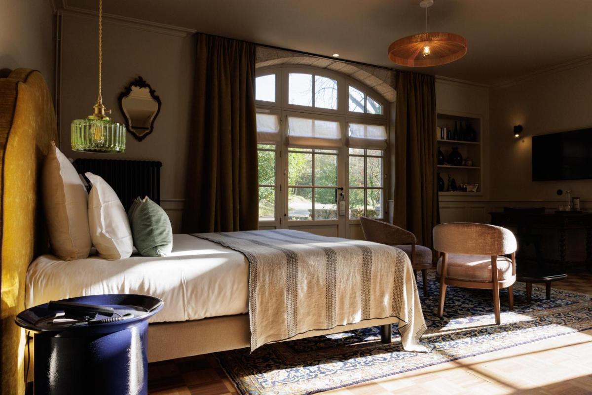 Un ou plusieurs lits dans un hébergement de l'établissement Domaine de Locguénolé & Spa - Relais & Chateaux