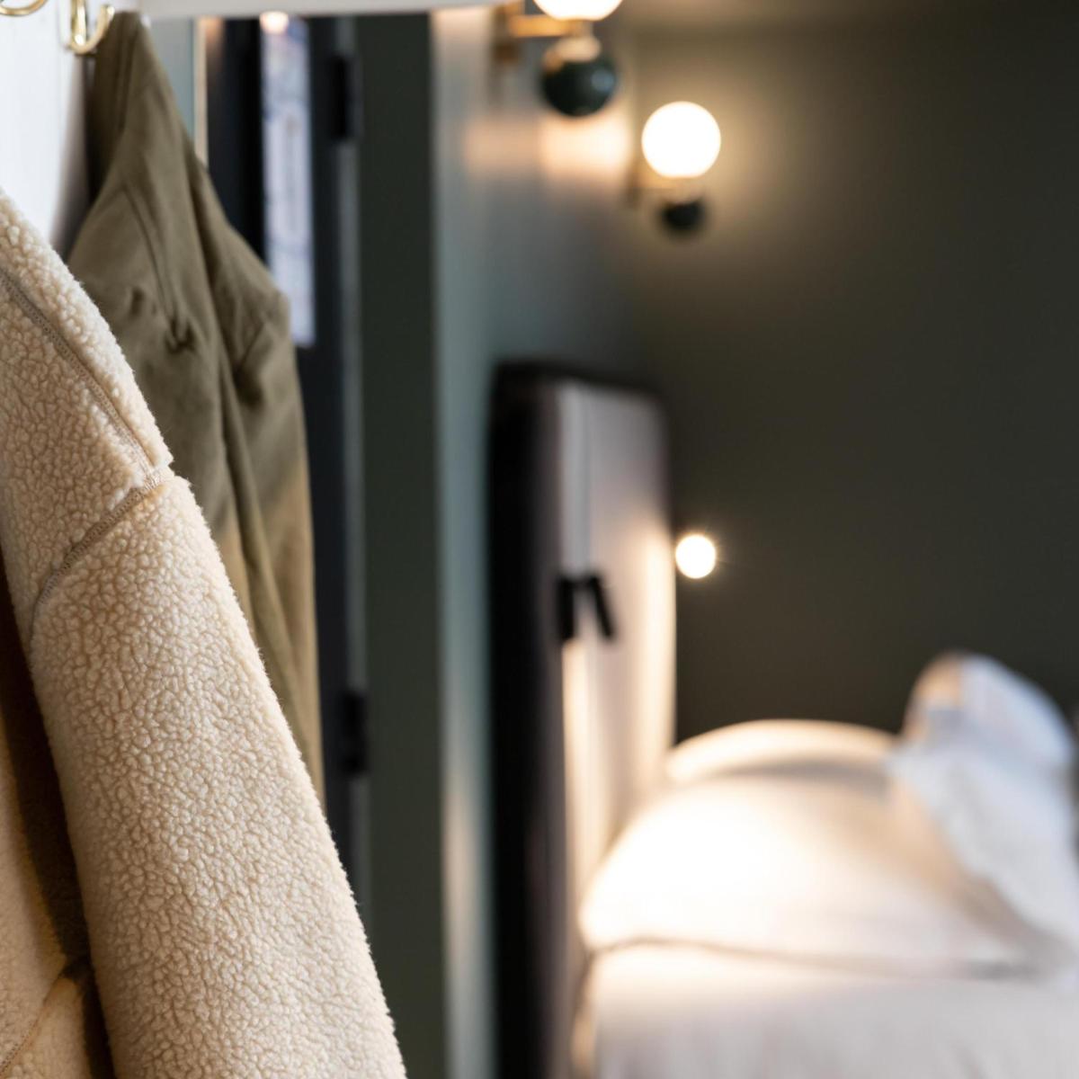 Un ou plusieurs lits dans un hébergement de l'établissement Le Celtique & Spa
