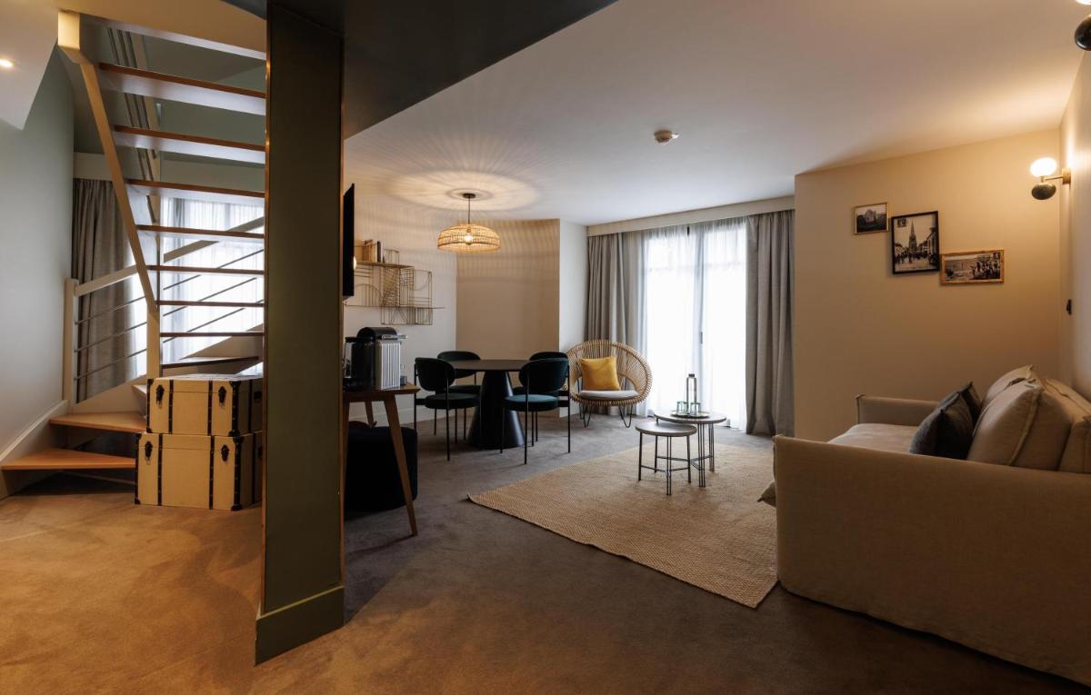 Coin salon dans l'établissement Le Celtique & Spa