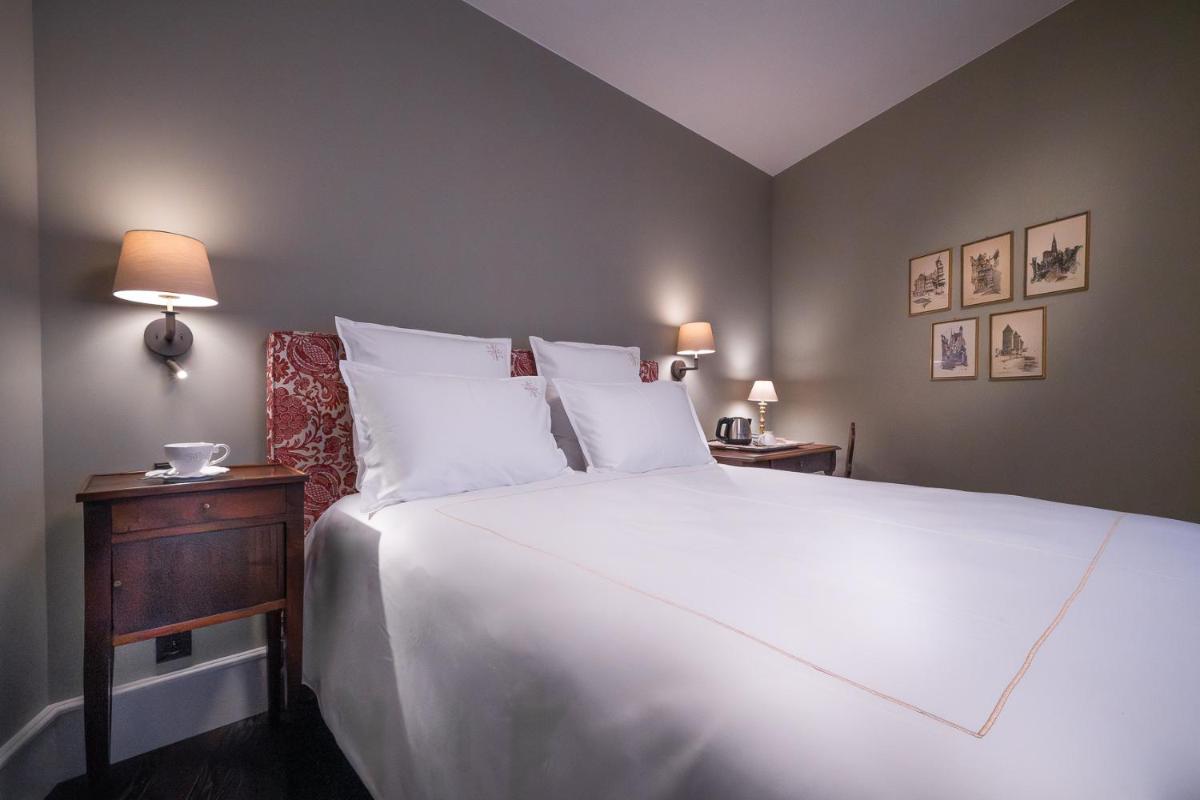 Un ou plusieurs lits dans un hébergement de l'établissement Hôtel & Spa Le Bouclier D'or