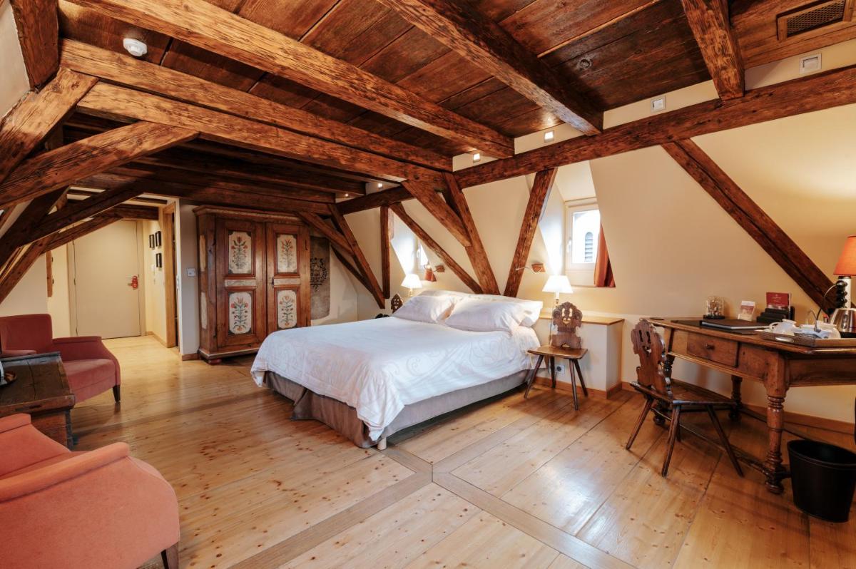 Un ou plusieurs lits dans un hébergement de l'établissement Hôtel & Spa Le Bouclier D'or