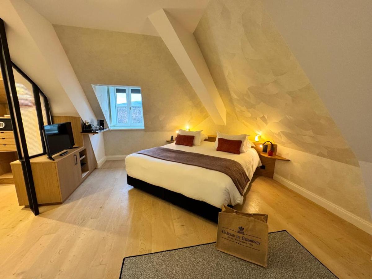 Un ou plusieurs lits dans un hébergement de l'établissement Chateau De Germigney