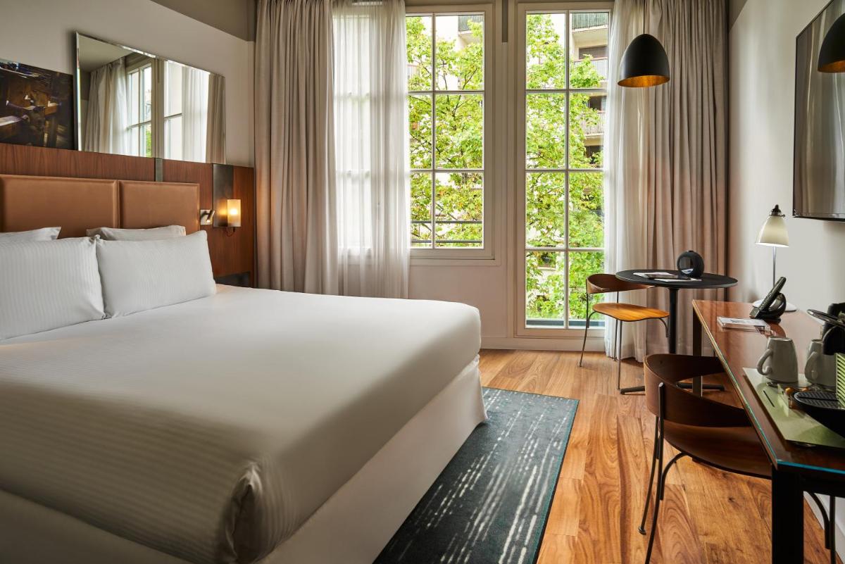 Un ou plusieurs lits dans un hébergement de l'établissement Boutet Bastille Hotel Paris - MGallery Collection
