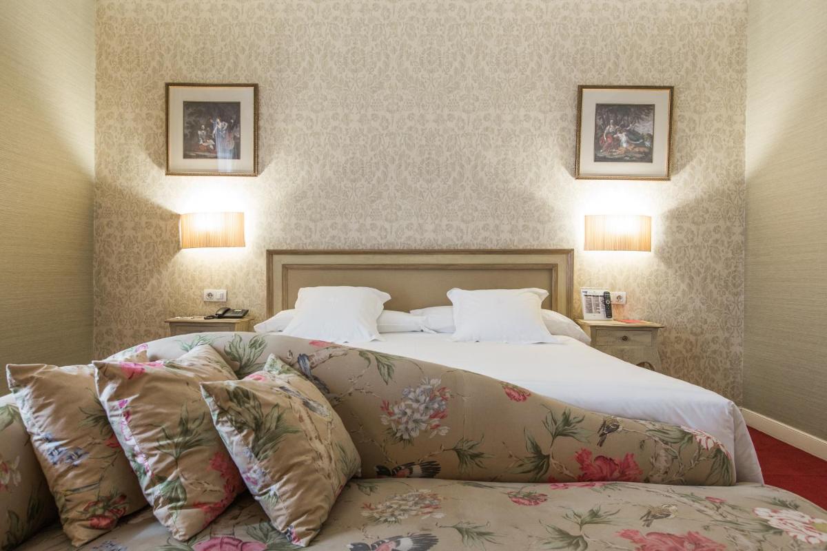 Cama o camas de una habitación en Hotel Carlton