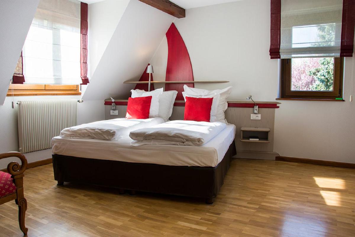 Un ou plusieurs lits dans un hébergement de l'établissement Hotel Spa et Restaurant Au Chasseur