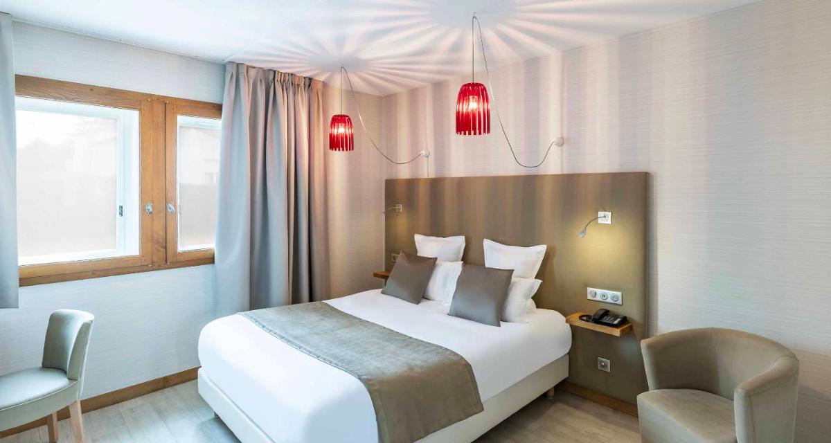 Un ou plusieurs lits dans un hébergement de l'établissement Auberge du Lac, Sure Hotel Collection by Best Western