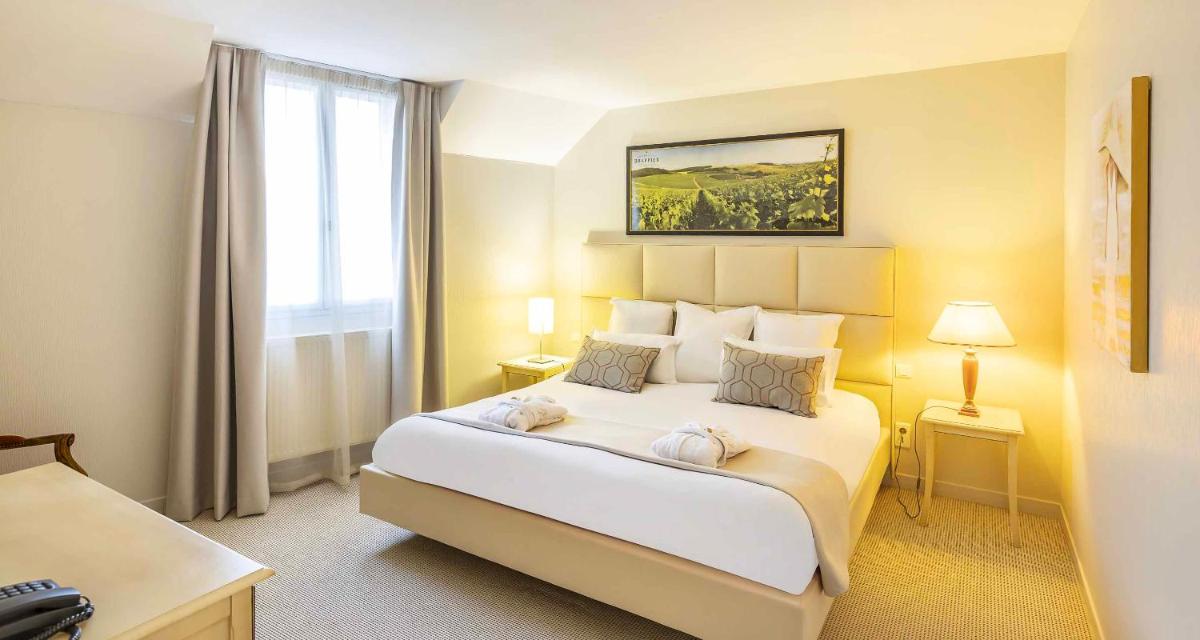 Un ou plusieurs lits dans un hébergement de l'établissement Auberge du Lac, Sure Hotel Collection by Best Western