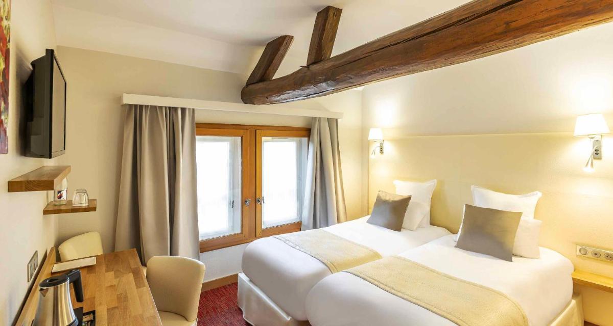 Un ou plusieurs lits dans un hébergement de l'établissement Auberge du Lac, Sure Hotel Collection by Best Western