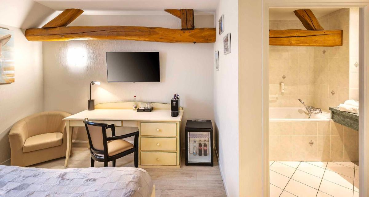 Un ou plusieurs lits dans un hébergement de l'établissement Auberge du Lac, Sure Hotel Collection by Best Western