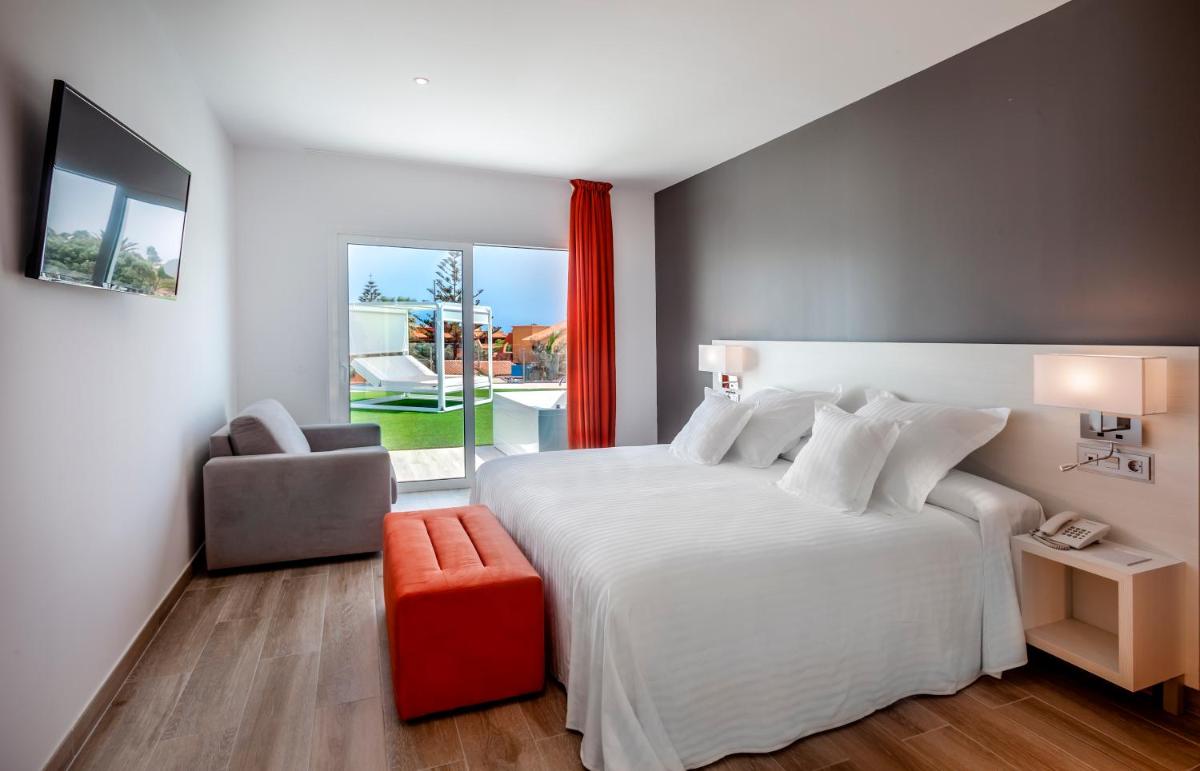 Cama o camas de una habitación en Barceló Corralejo Sands