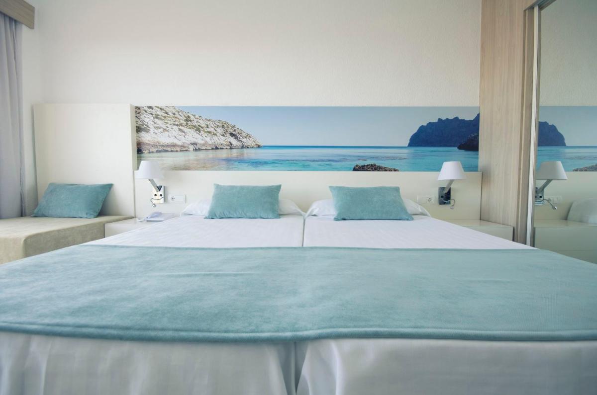 Cama o camas de una habitación en azuLine Hotel Bahamas y Bahamas II