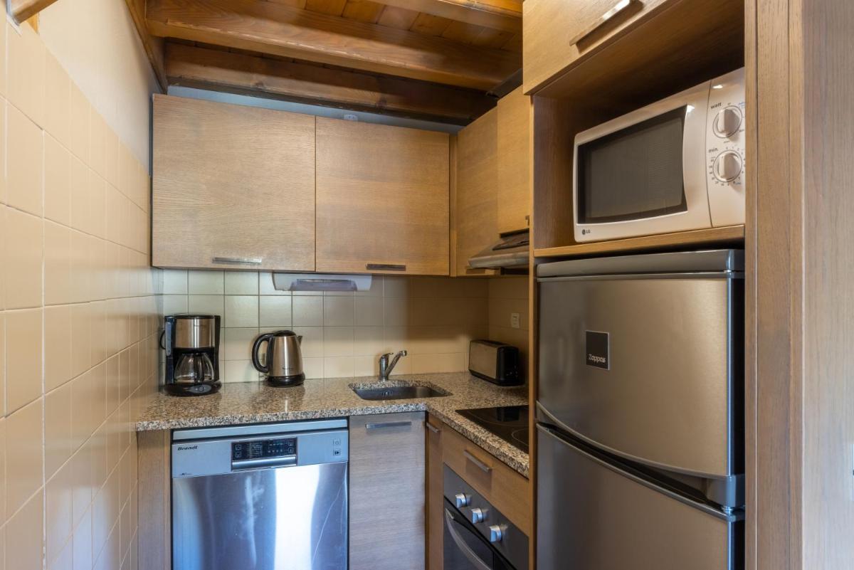 Cuisine ou kitchenette dans l'établissement Résidences Village Montana by Les Etincelles