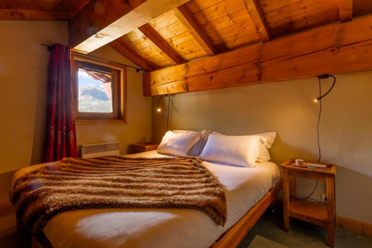 Un ou plusieurs lits dans un hébergement de l'établissement Résidences Village Montana by Les Etincelles