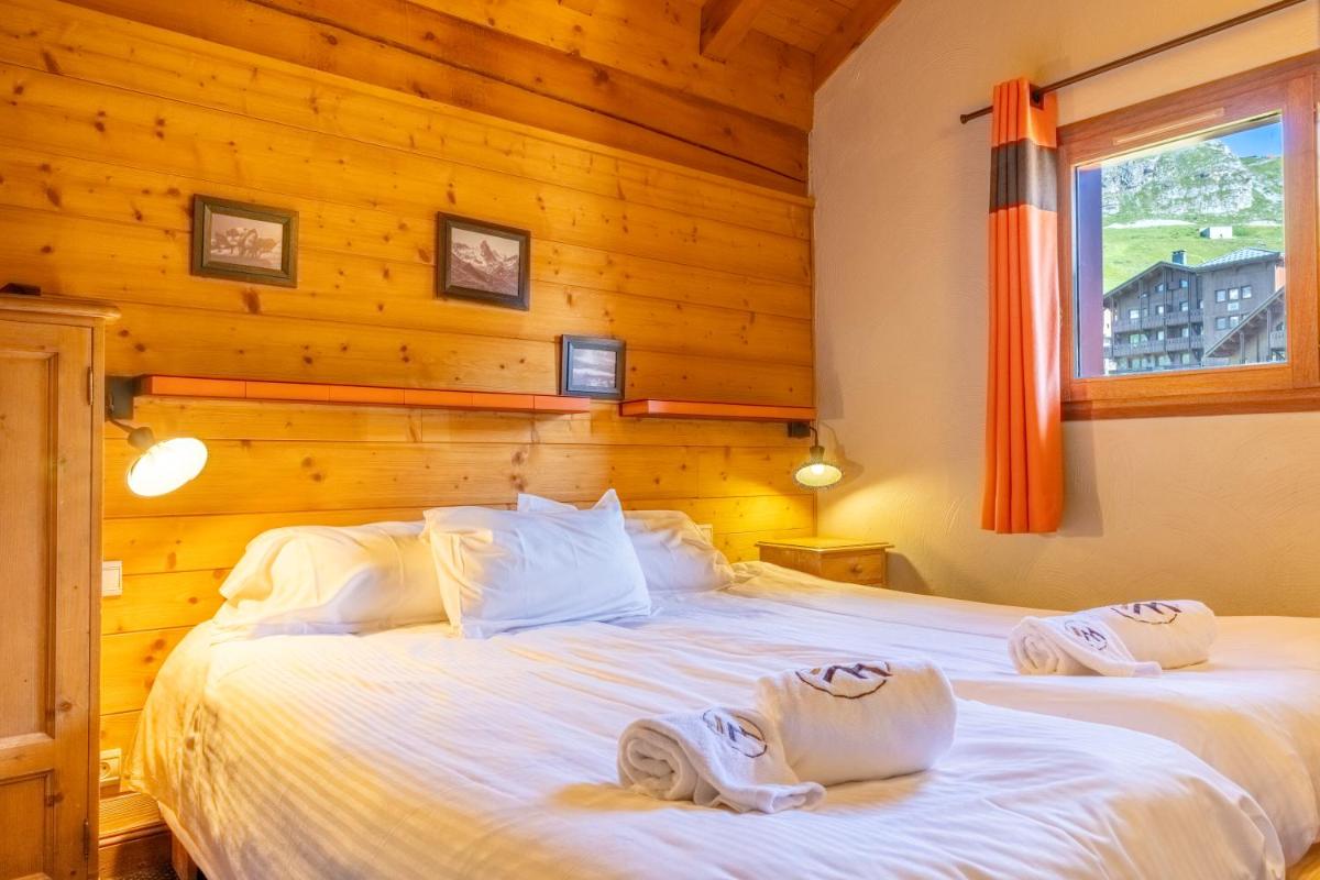 Un ou plusieurs lits dans un hébergement de l'établissement Résidences Village Montana by Les Etincelles