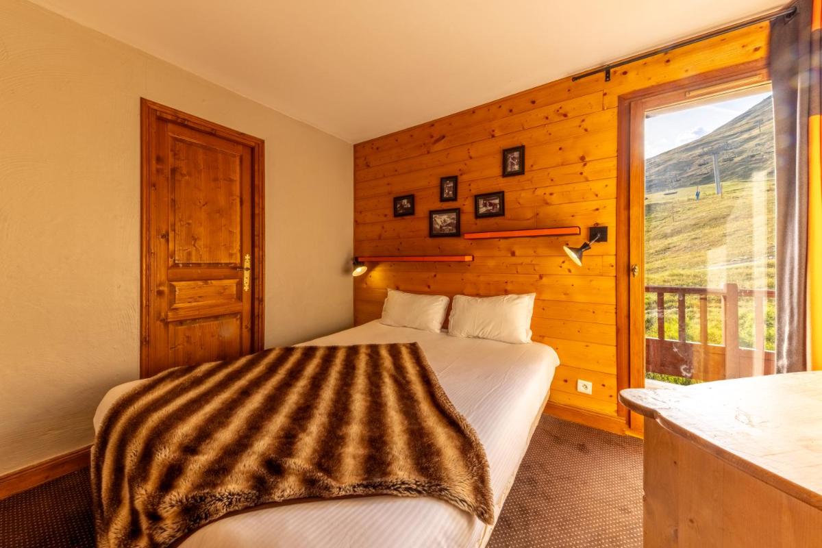 Un ou plusieurs lits dans un hébergement de l'établissement Résidences Village Montana by Les Etincelles