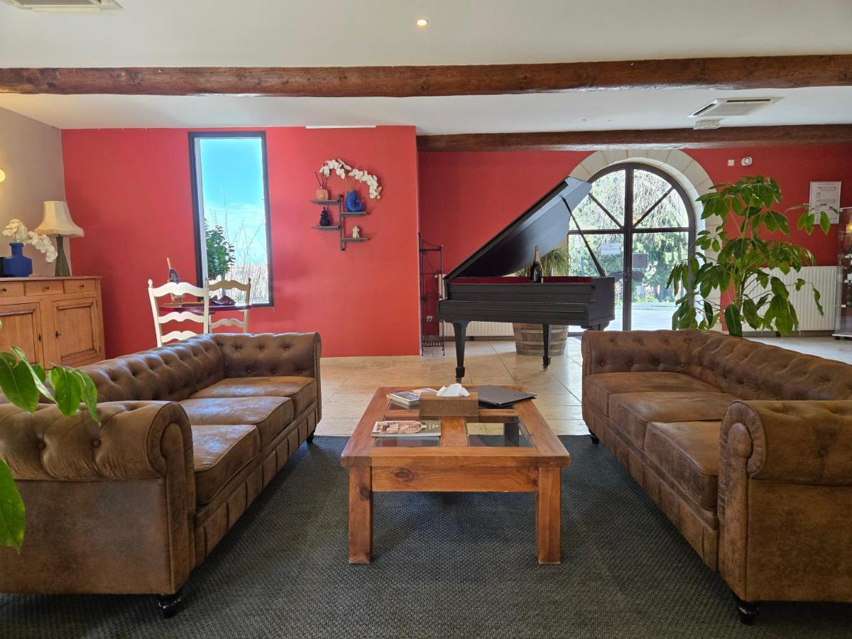 Coin salon dans l'établissement CÉRÈS - Boutique-Hôtel & Spa