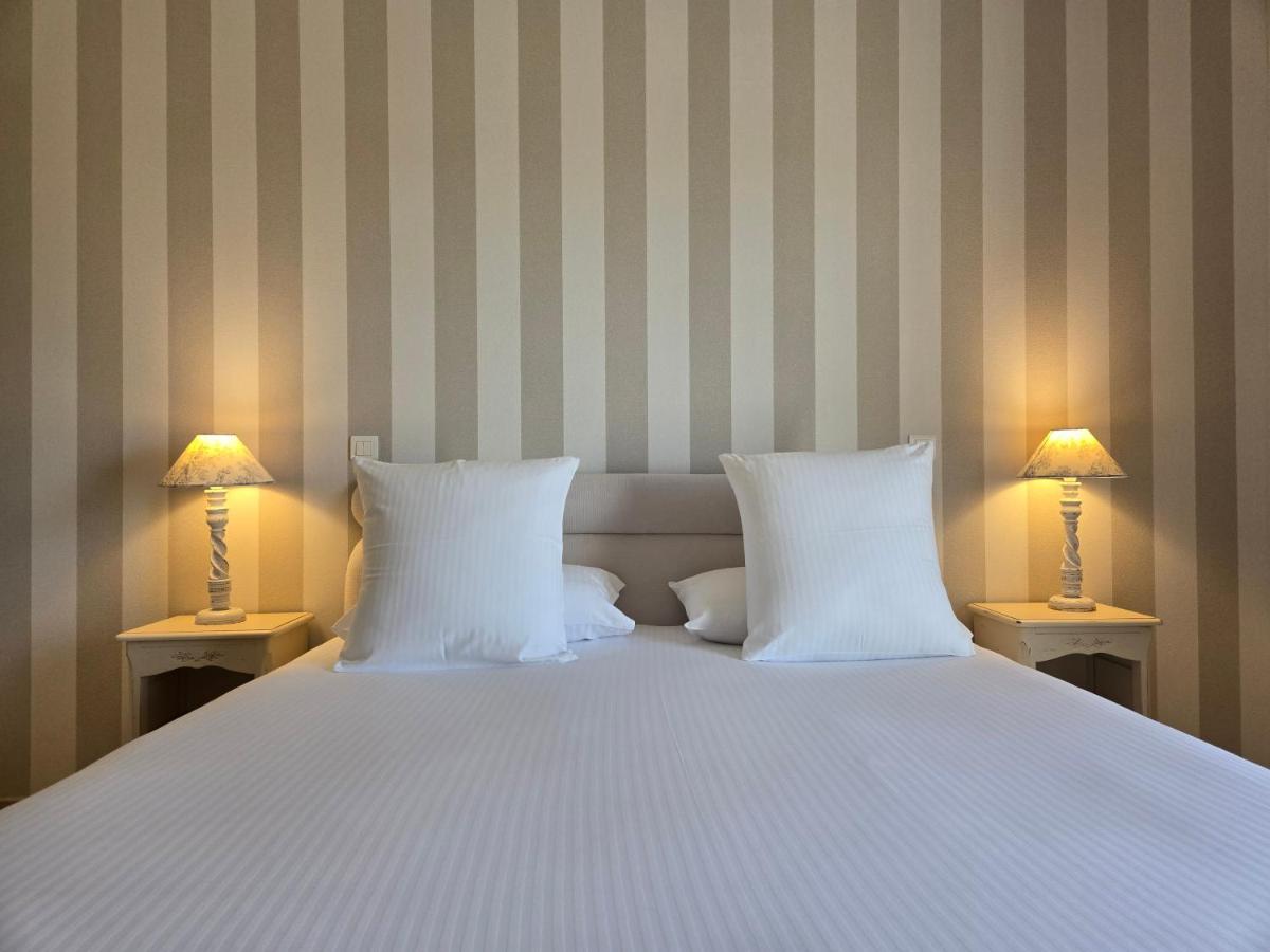 Un ou plusieurs lits dans un hébergement de l'établissement CÉRÈS - Boutique-Hôtel & Spa