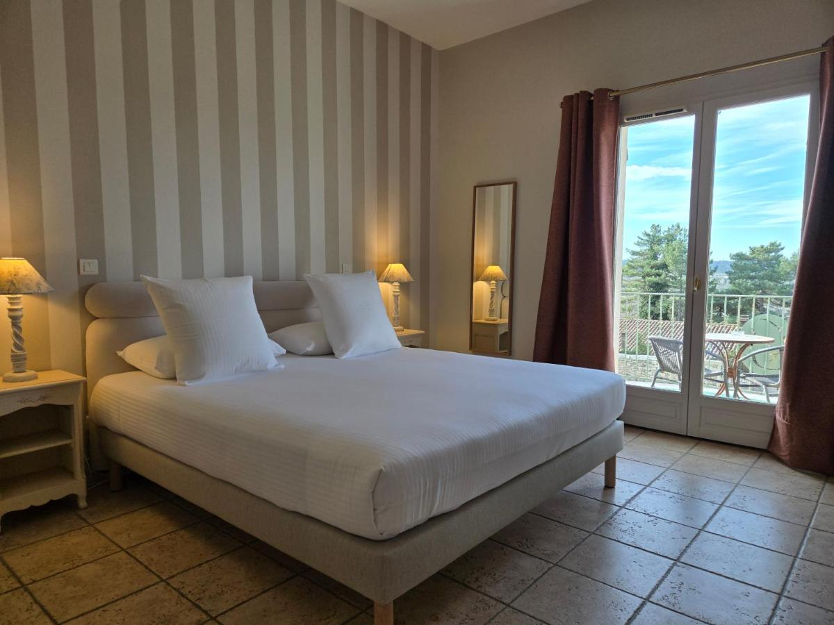 Un ou plusieurs lits dans un hébergement de l'établissement CÉRÈS - Boutique-Hôtel & Spa