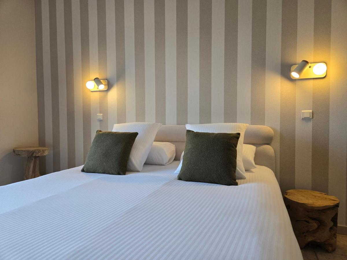 Un ou plusieurs lits dans un hébergement de l'établissement CÉRÈS - Boutique-Hôtel & Spa