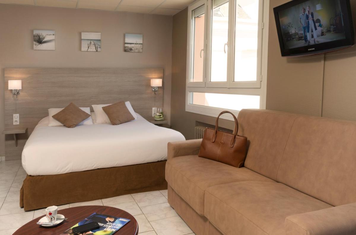 Un ou plusieurs lits dans un hébergement de l'établissement Hotel Regina & Spa