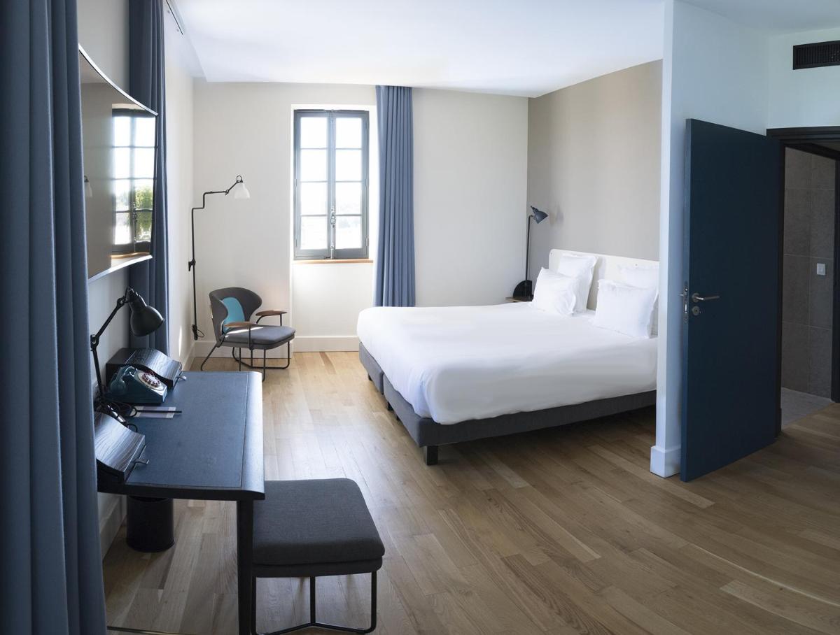 Un ou plusieurs lits dans un hébergement de l'établissement Fourvière Hôtel