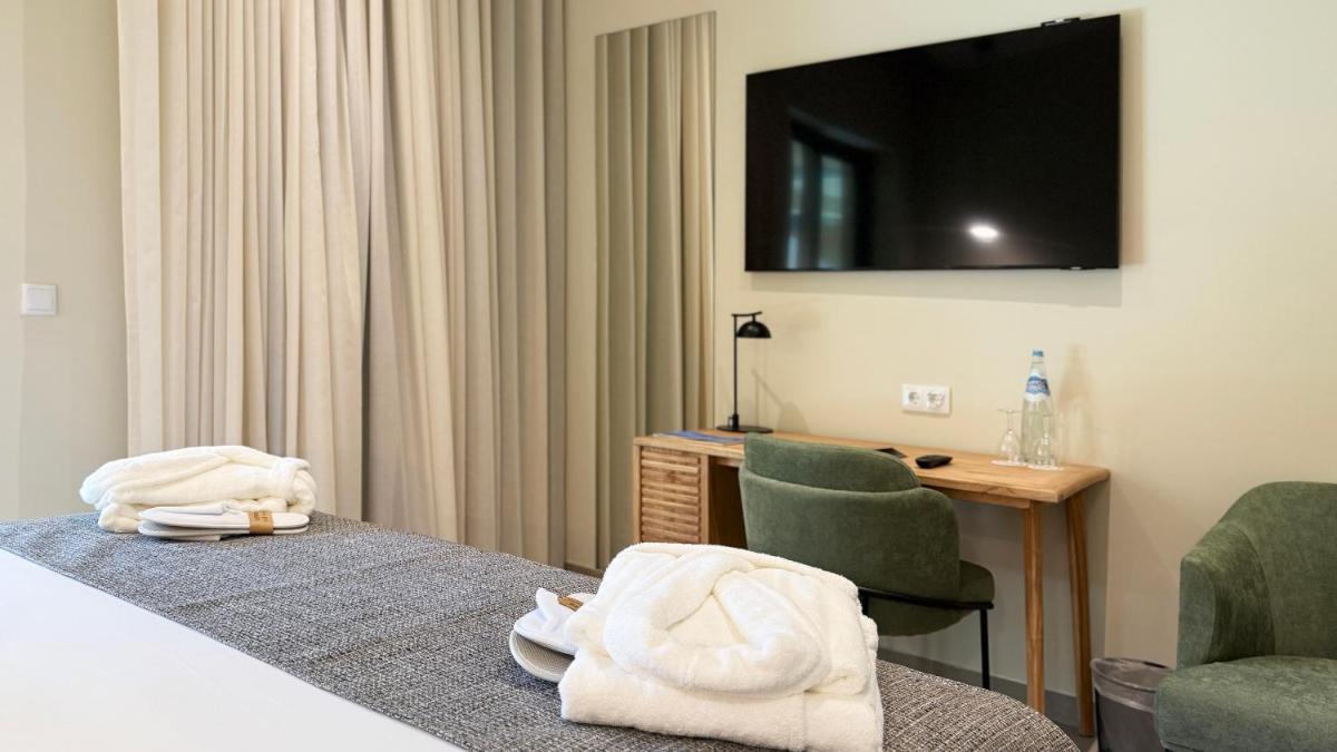 Uma cama ou camas num quarto em AP Lago Montargil - Conference & SPA