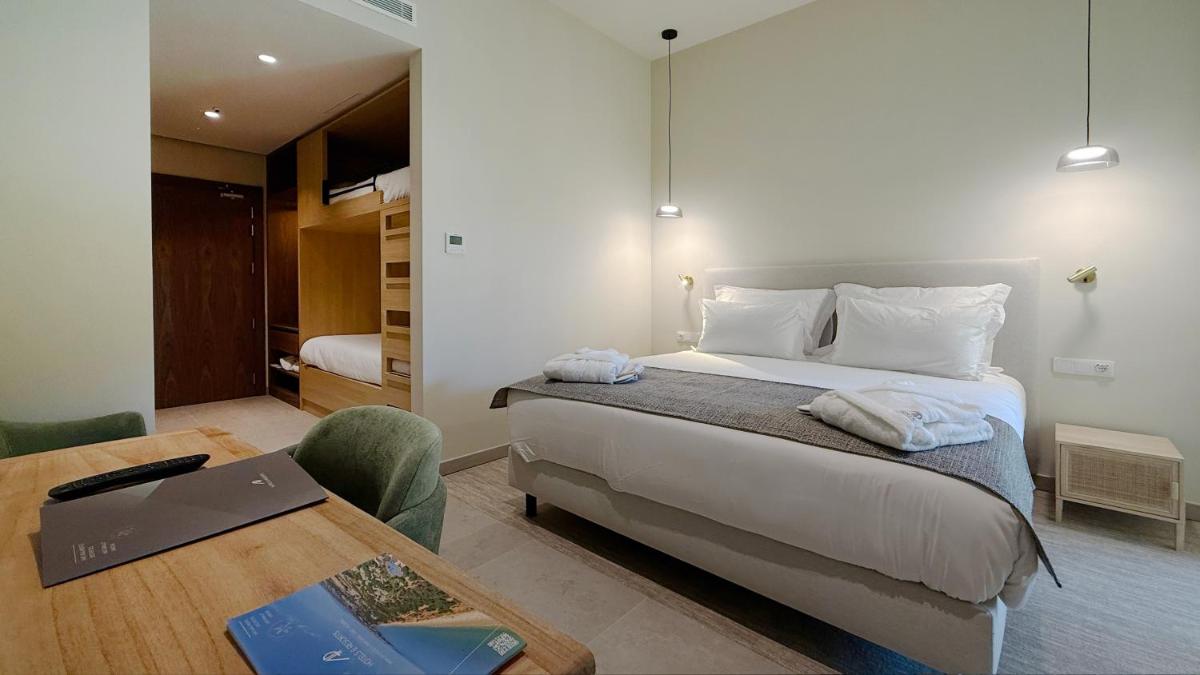 Uma cama ou camas num quarto em AP Lago Montargil - Conference & SPA