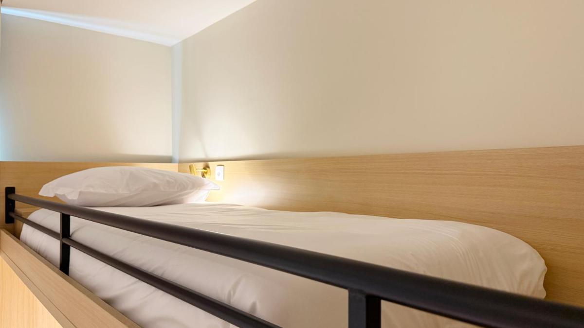 Uma cama ou camas num quarto em AP Lago Montargil - Conference & SPA