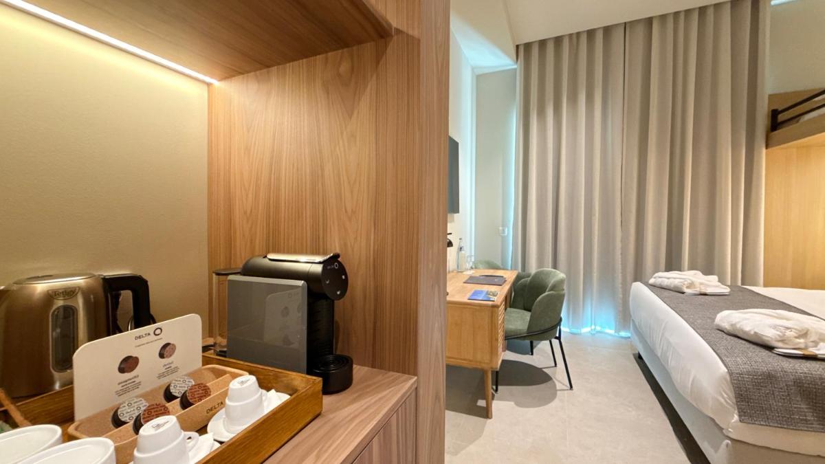 Uma cama ou camas num quarto em AP Lago Montargil - Conference & SPA