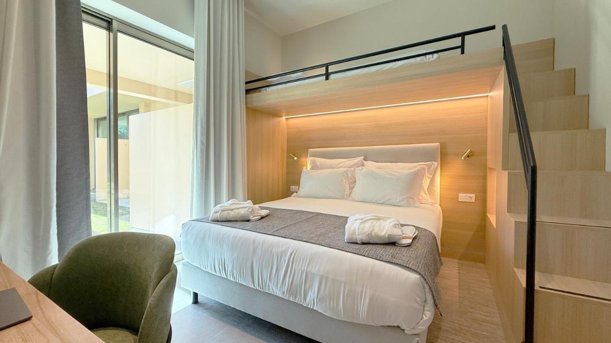 Uma cama ou camas num quarto em AP Lago Montargil - Conference & SPA