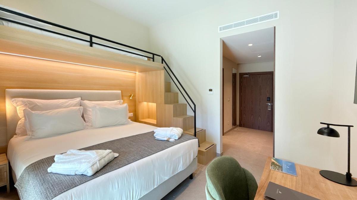 Uma cama ou camas num quarto em AP Lago Montargil - Conference & SPA