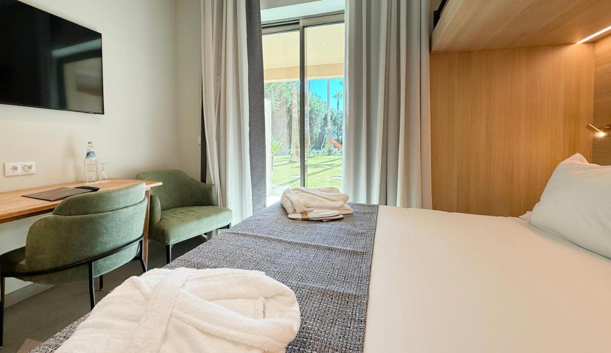 Uma cama ou camas num quarto em AP Lago Montargil - Conference & SPA