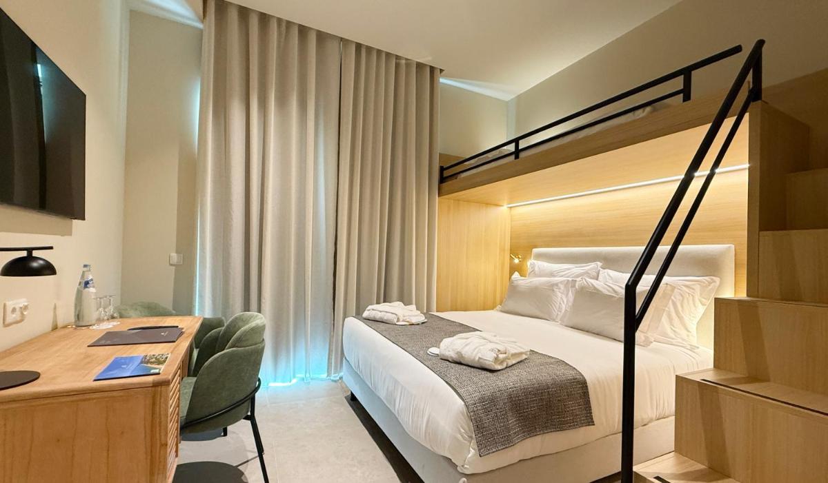 Uma cama ou camas num quarto em AP Lago Montargil - Conference & SPA