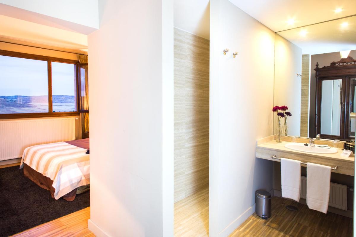 Cama o camas de una habitación en Hotel Cardamomo Sigüenza
