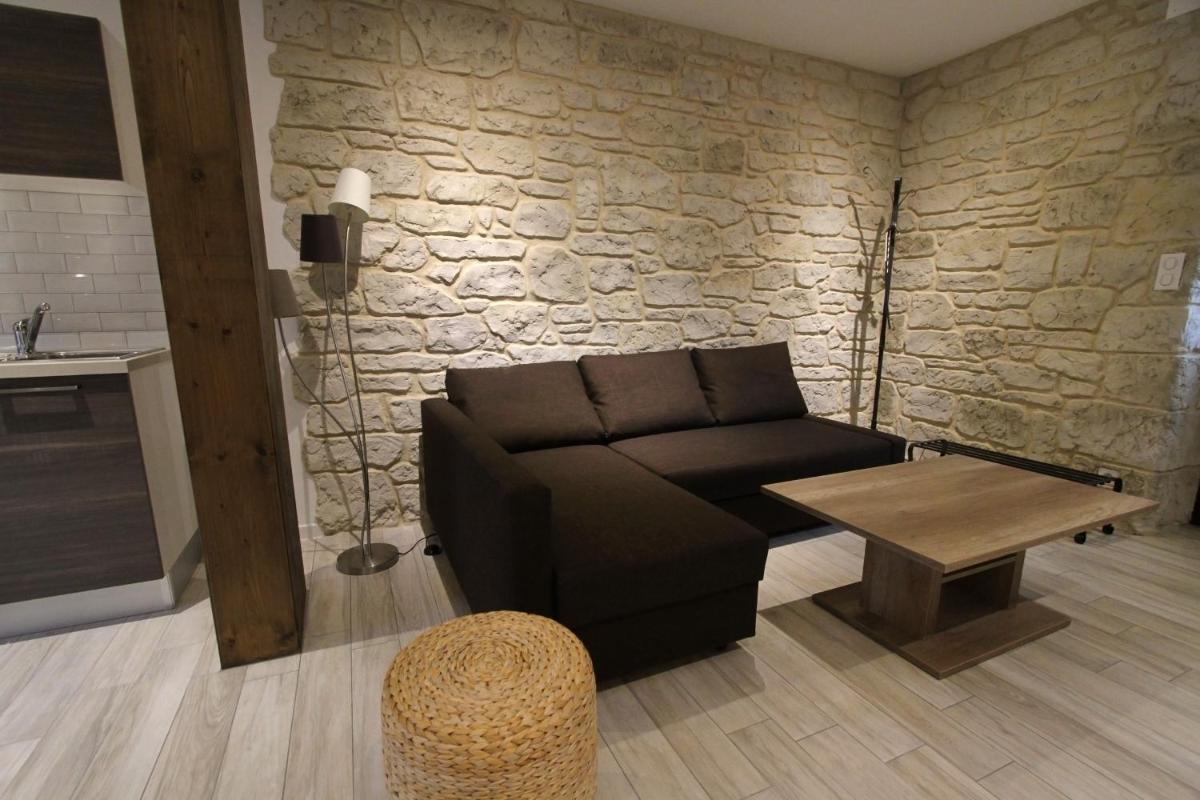 Coin salon dans l'établissement Le Moulin d'Oscar & Spa - Mulhouse Nord