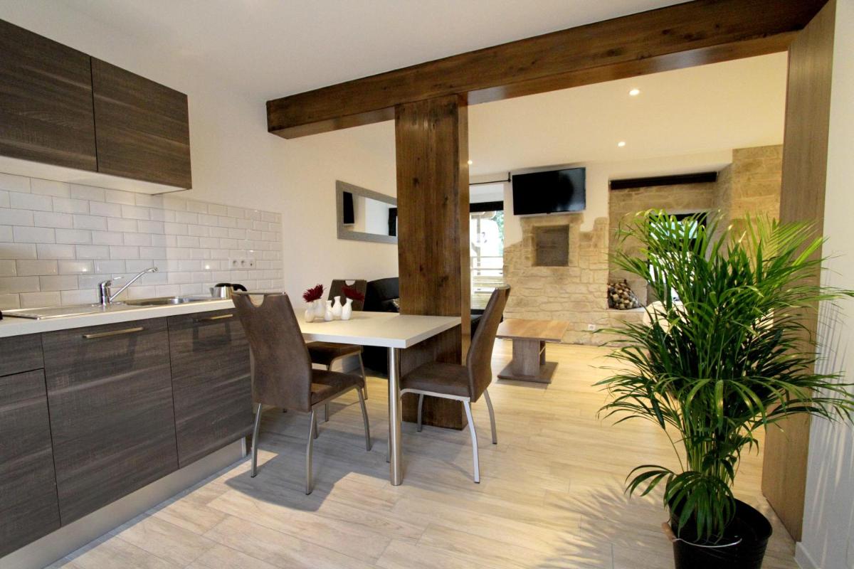 Télévision ou salle de divertissement dans l'établissement Le Moulin d'Oscar & Spa - Mulhouse Nord