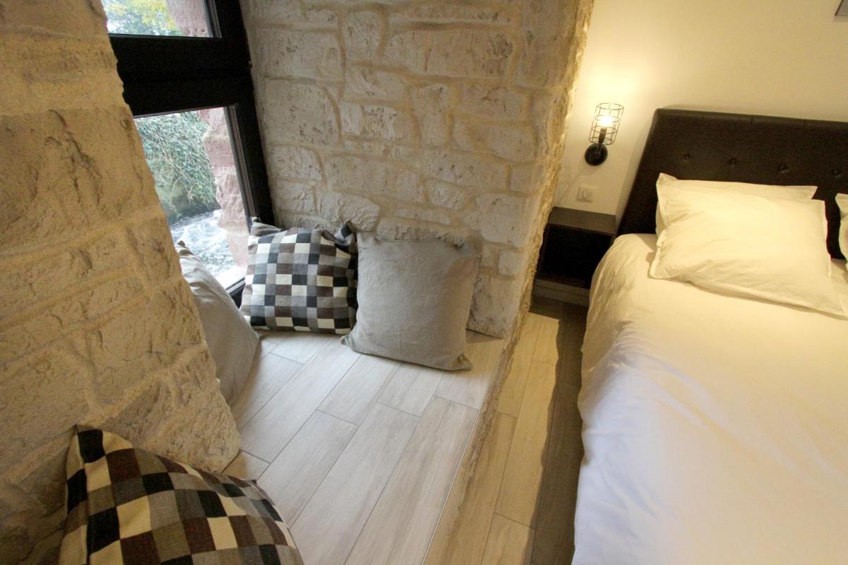 Un ou plusieurs lits dans un hébergement de l'établissement Le Moulin d'Oscar & Spa - Mulhouse Nord