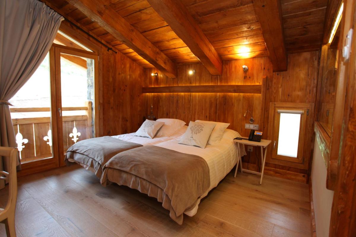 Cama o camas de una habitación en Hotel Viñas de Lárrede