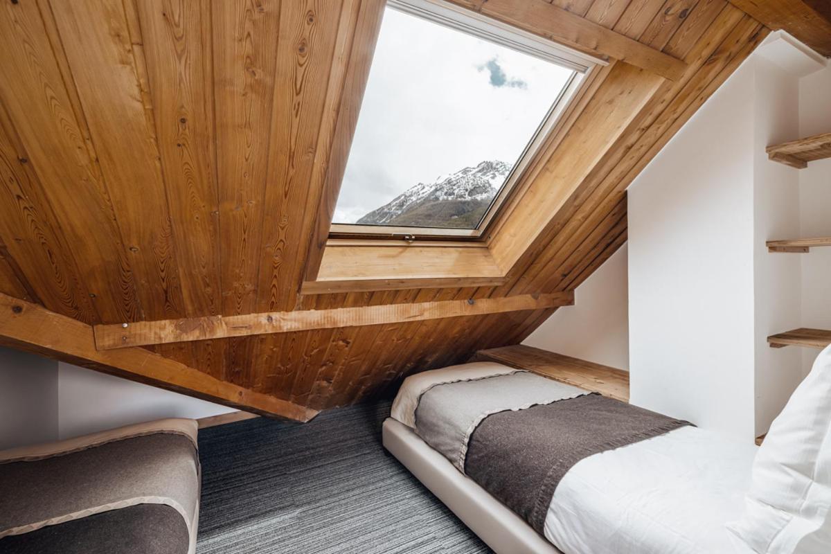 Un ou plusieurs lits dans un hébergement de l'établissement Alliey & Spa Piscine Appart-hôtel Serre chevalier
