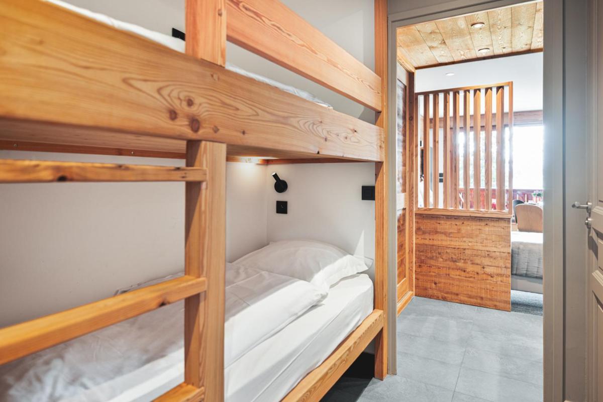 Un ou plusieurs lits dans un hébergement de l'établissement Alliey & Spa Piscine Appart-hôtel Serre chevalier