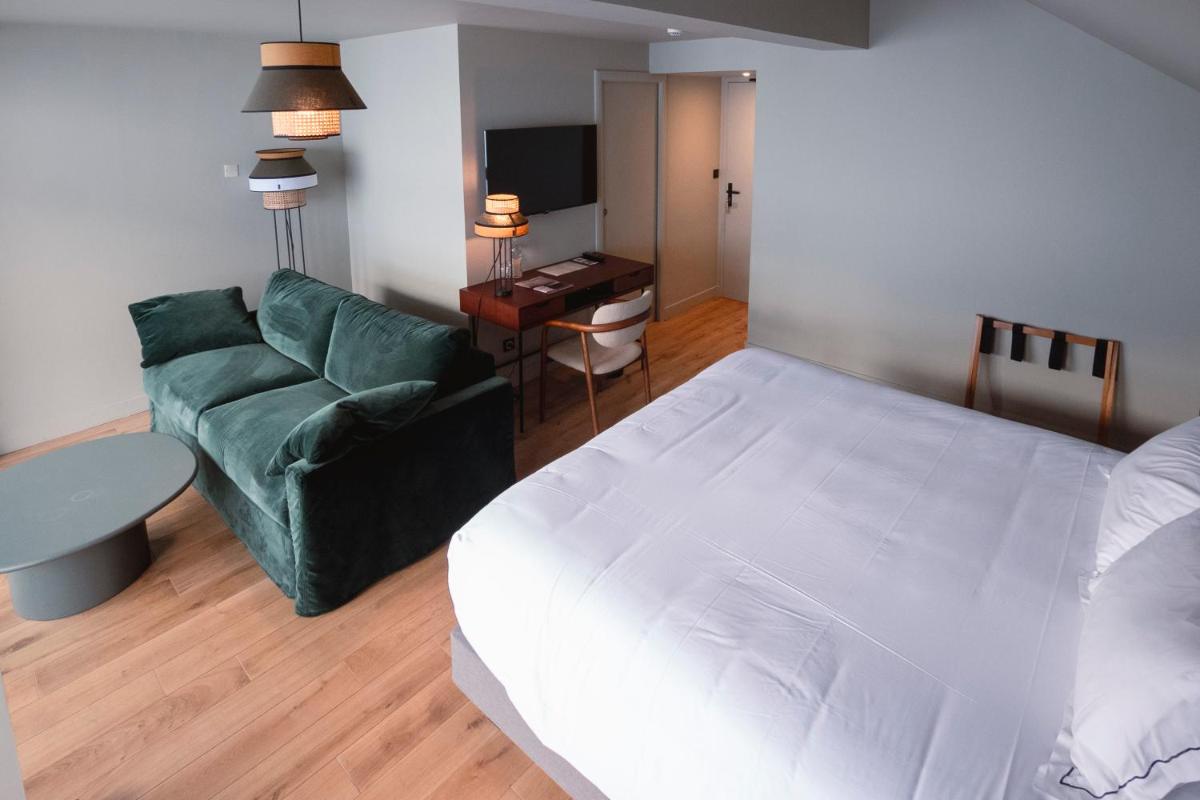 Un ou plusieurs lits dans un hébergement de l'établissement Les Cèdres - Hôtel - Restaurants - Spa