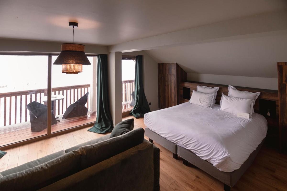 Un ou plusieurs lits dans un hébergement de l'établissement Les Cèdres - Hôtel - Restaurants - Spa