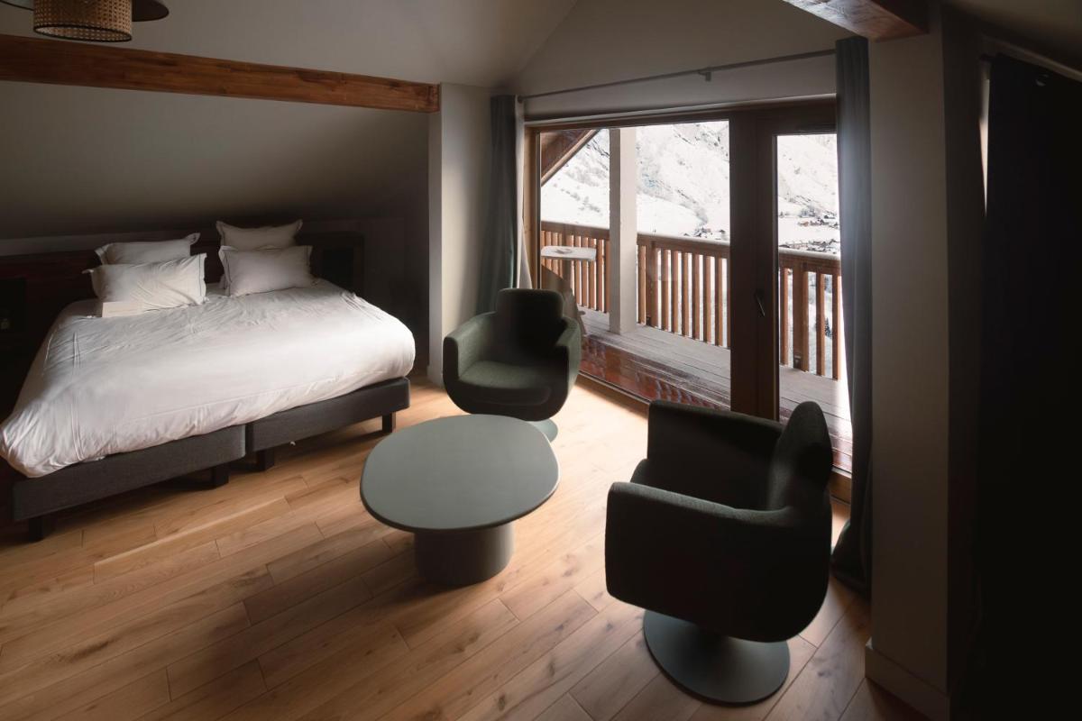 Un ou plusieurs lits dans un hébergement de l'établissement Les Cèdres - Hôtel - Restaurants - Spa